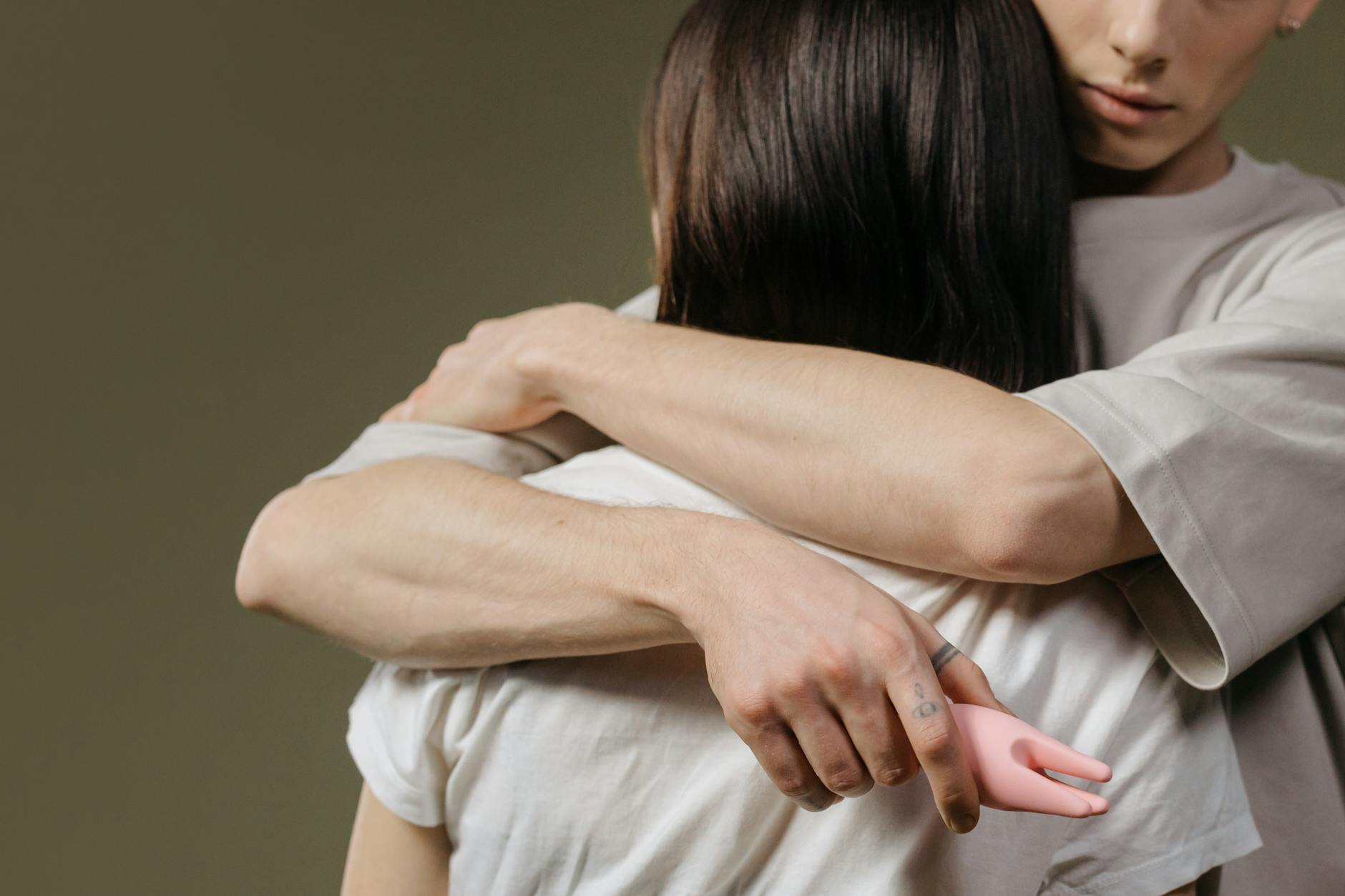 Close-up of a couple embracing, highlighting intimacy and connection and shared vulnerability