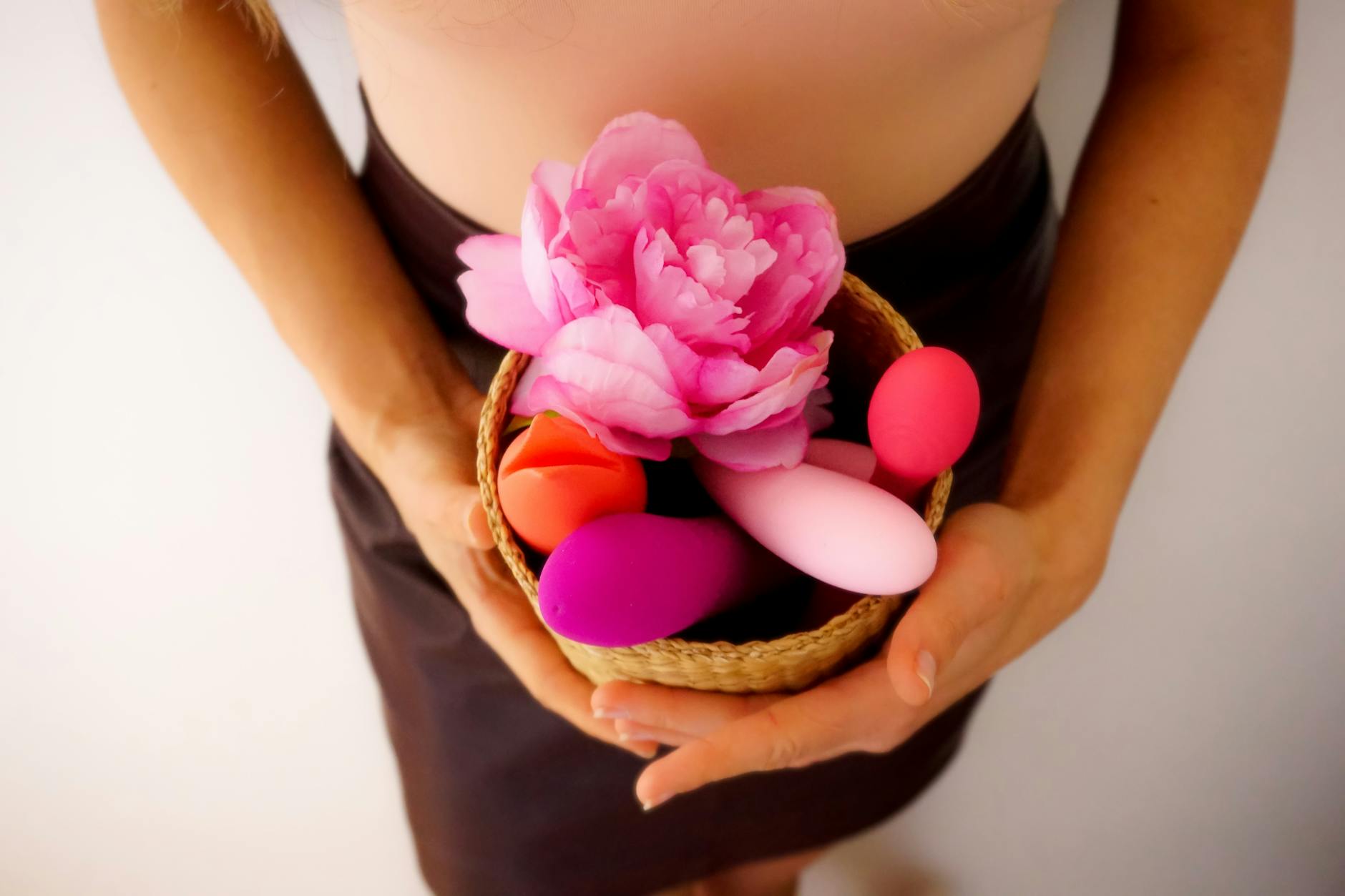 A colorful collection of lemon clitoral vibrators and personal massagers arranged with fresh flowers